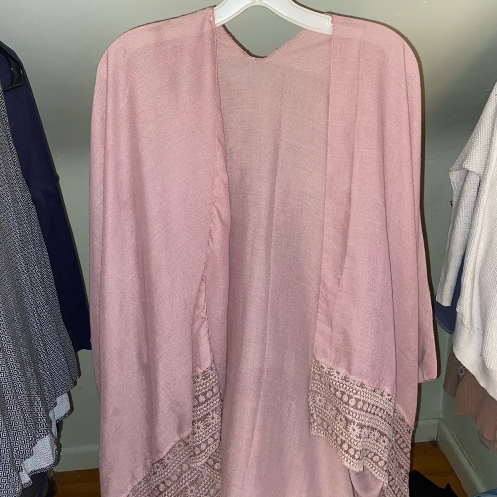 Pink shawl with lacy design on bottom